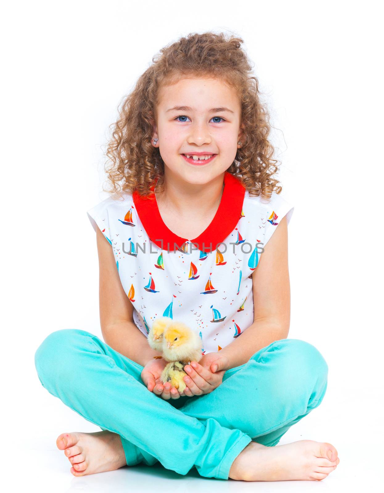 Happy little girl holding baby chickens - isolated white background