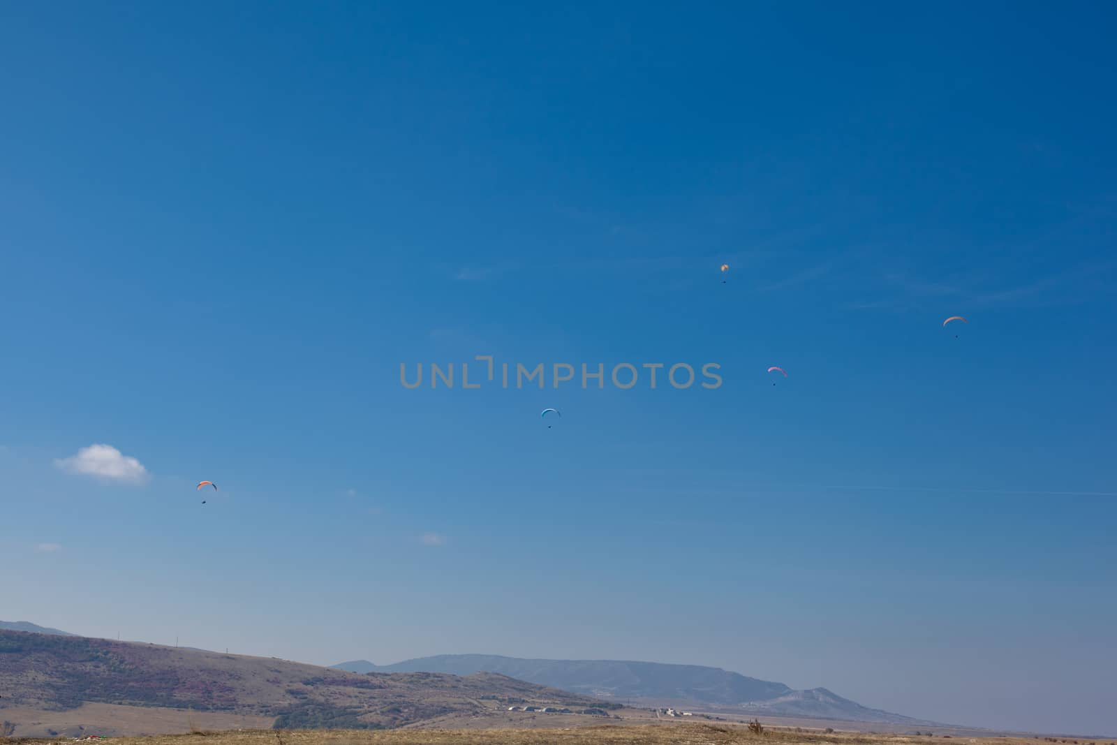 Several flying paparlanes over Klementyev hill in Crimea
