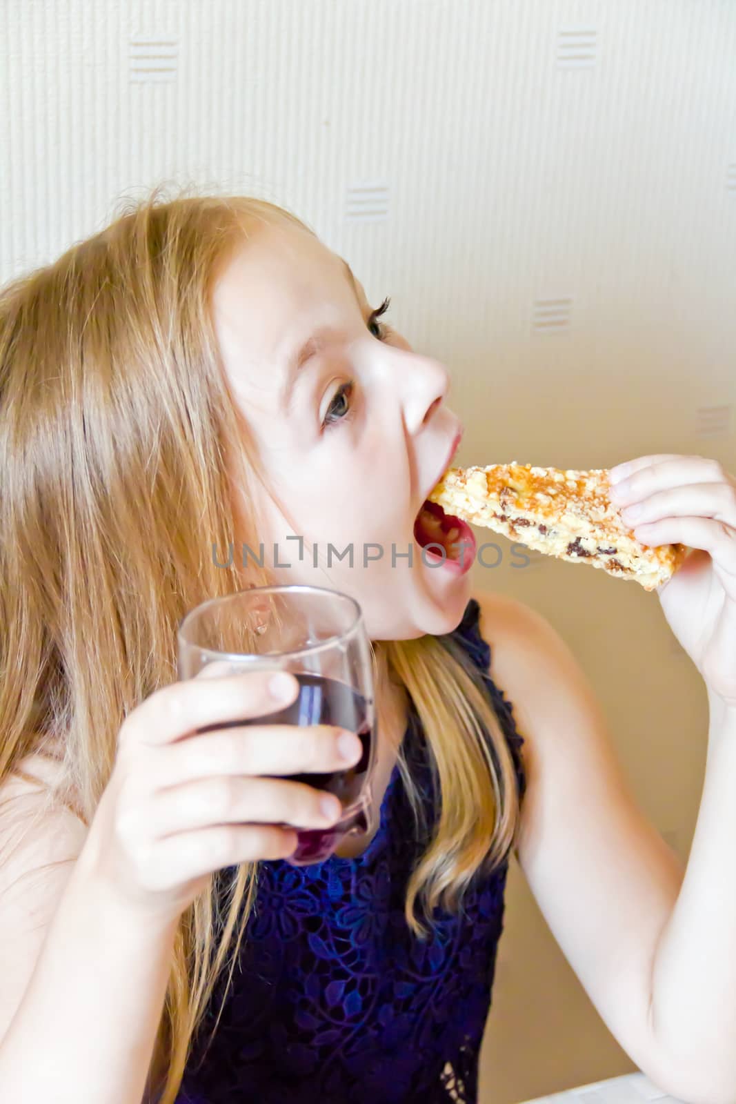 Photo of eating cute girl with blond hair