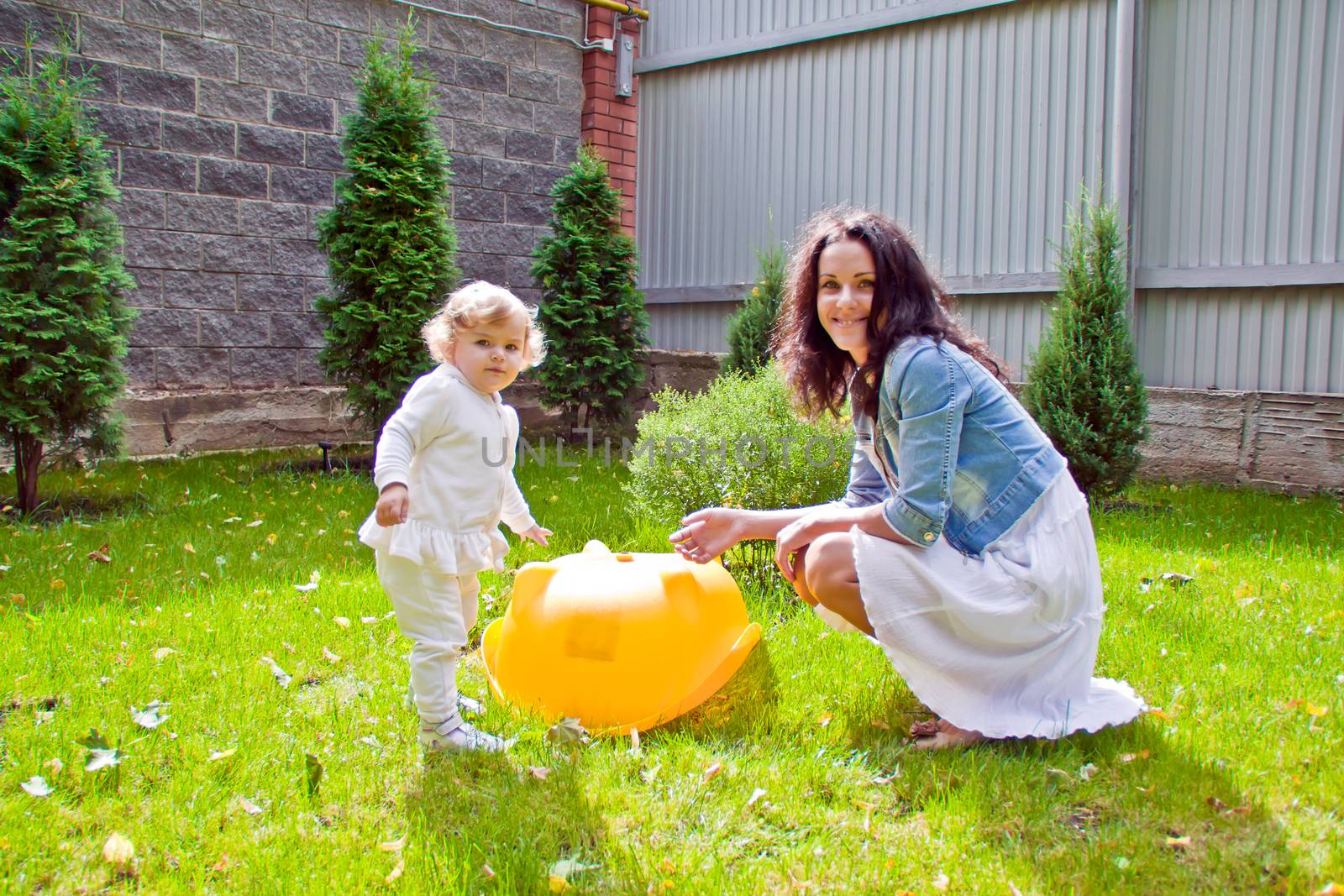 Photo of smiling mother and baby in summer