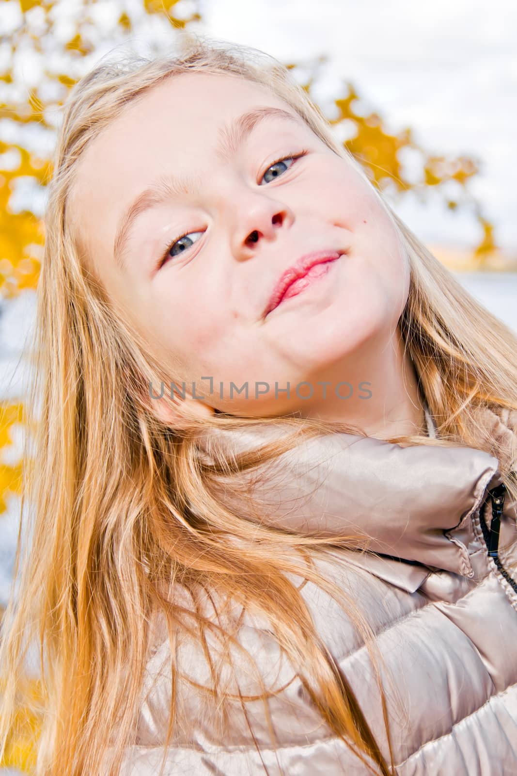 Photo of cute smiling girl in autumn