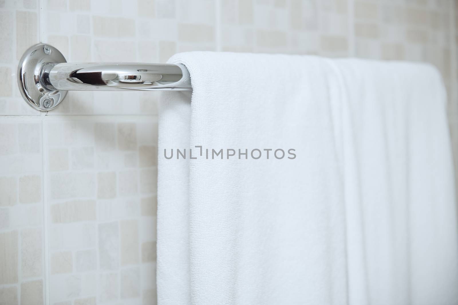 Towel drying on the rail in bathroom