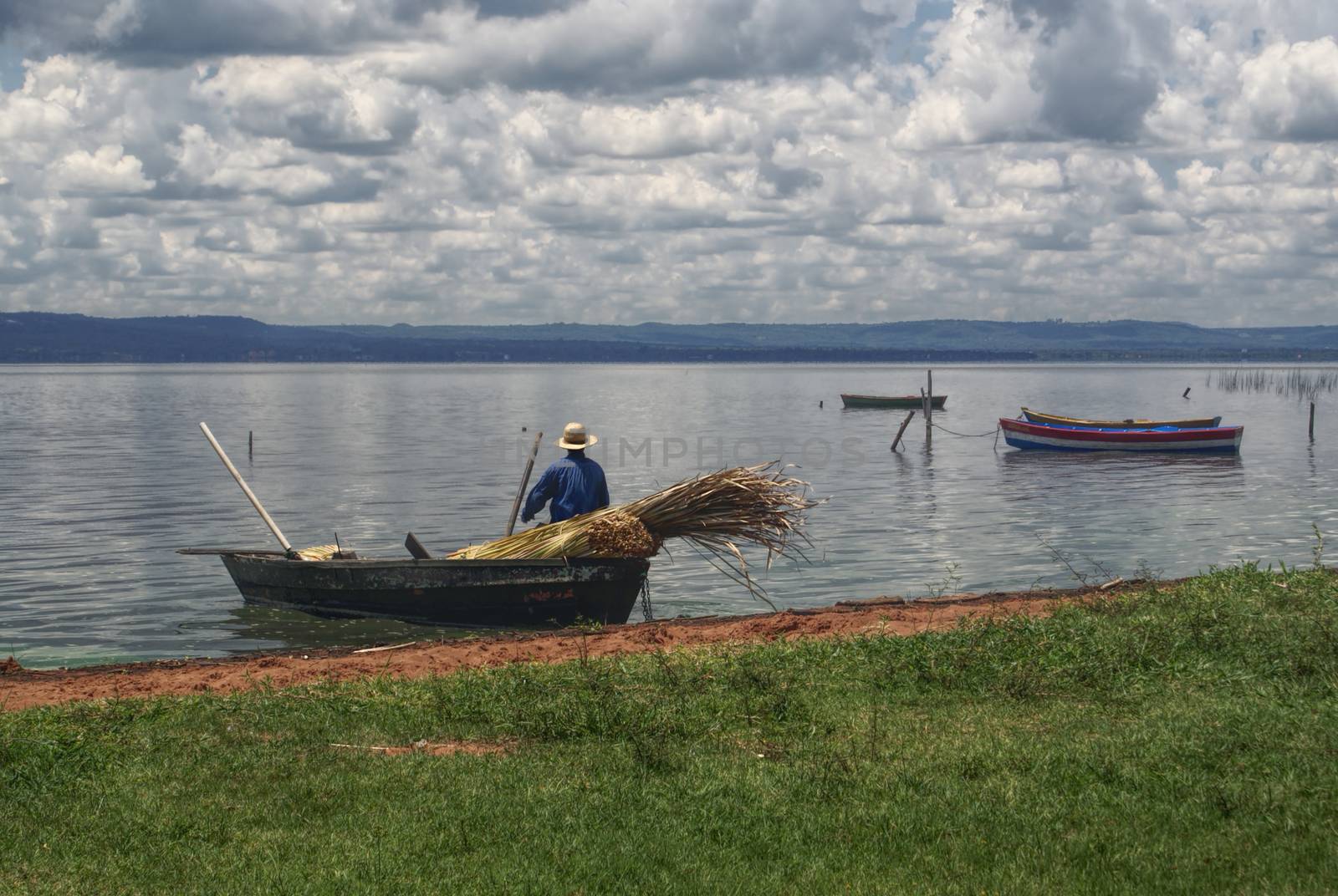 Fisherman leaving the river bank in Paraguay                   