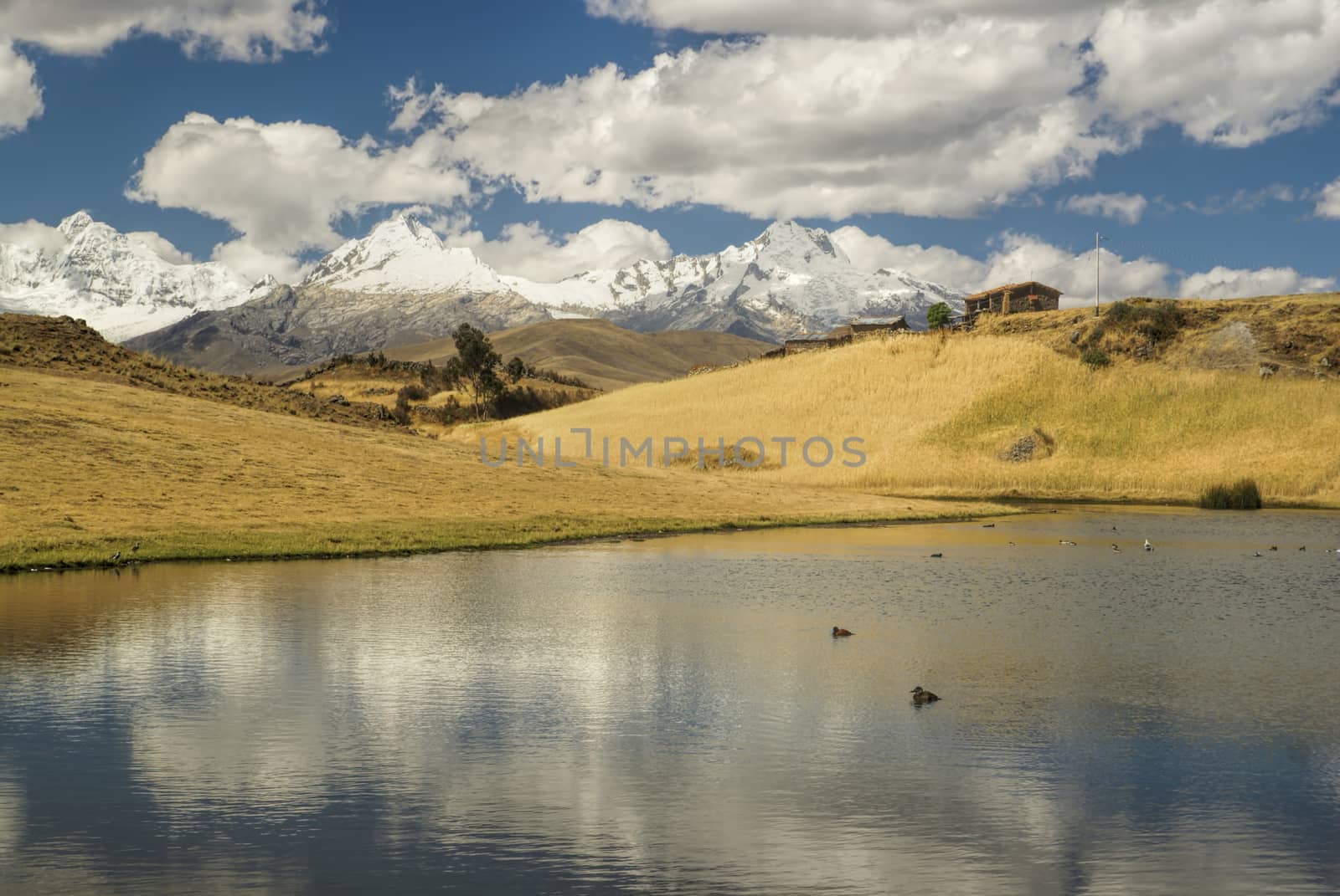 Picturesque view of clouds reflected on the surface of a lake in Cordillera Negra, Peru