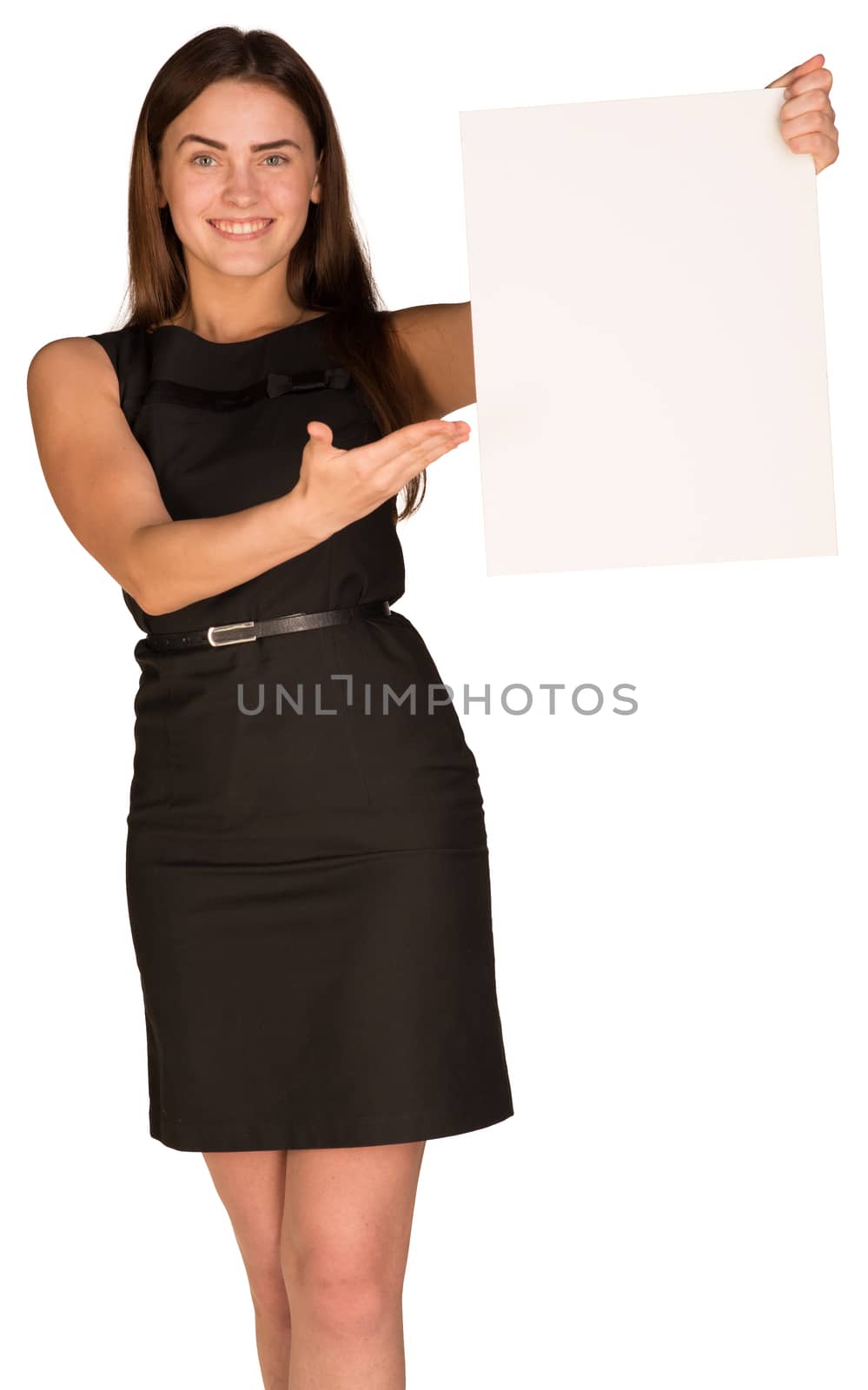 Businesswoman in dress holding and pointing at blank sheet of white paper