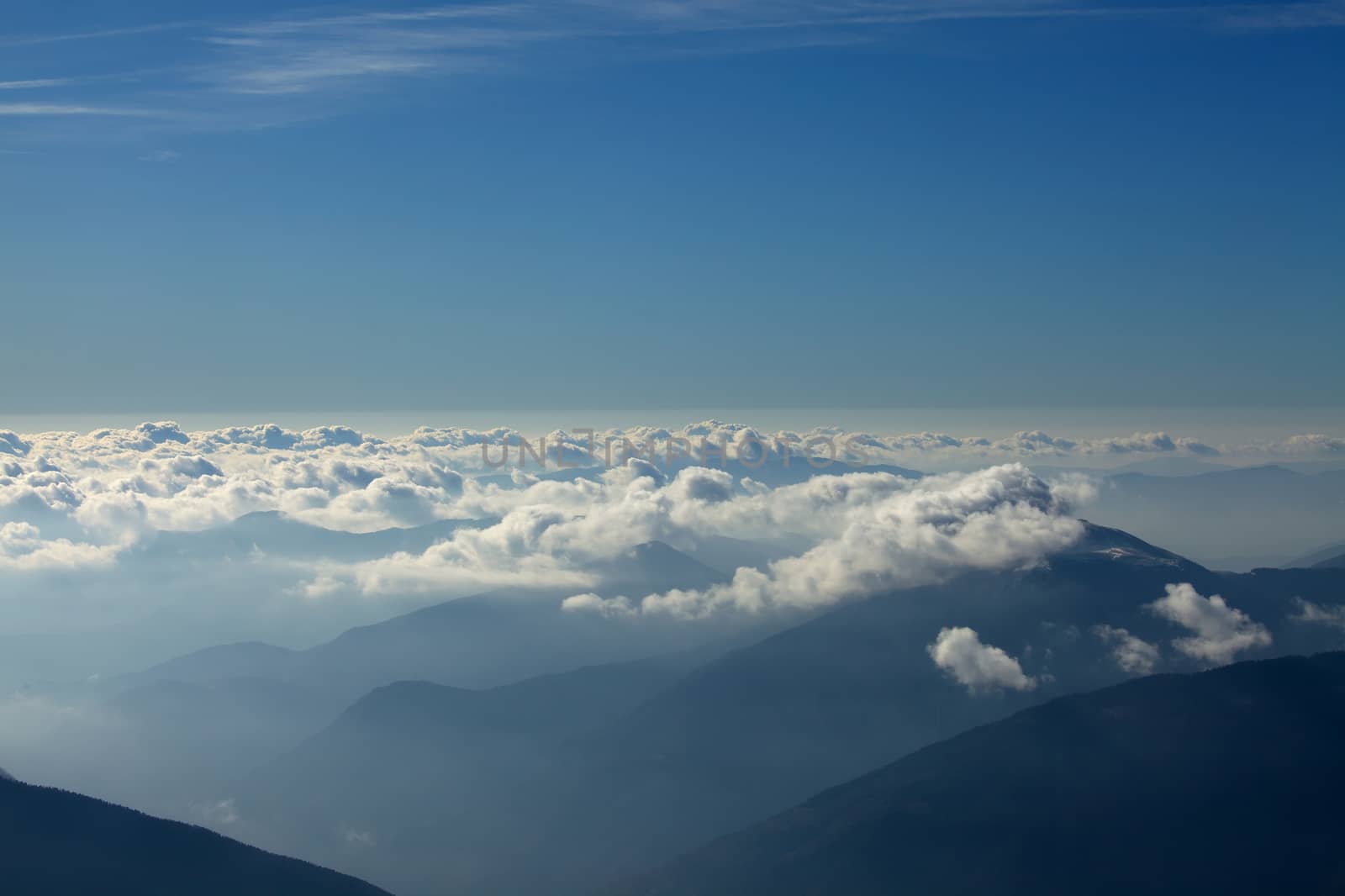 Misty mountain landscape above the clouds