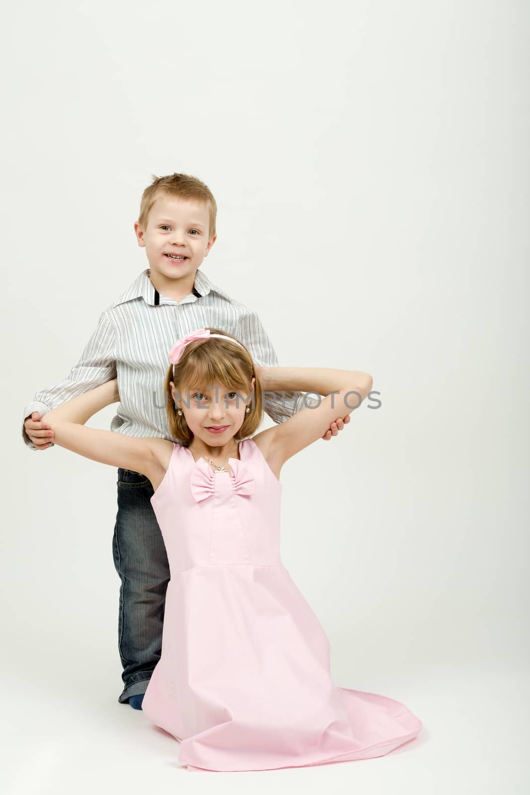 Studio portrait of siblings beautiful boy and girl