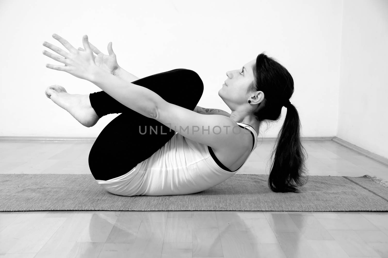 Young girl doing yoga pose by anderm