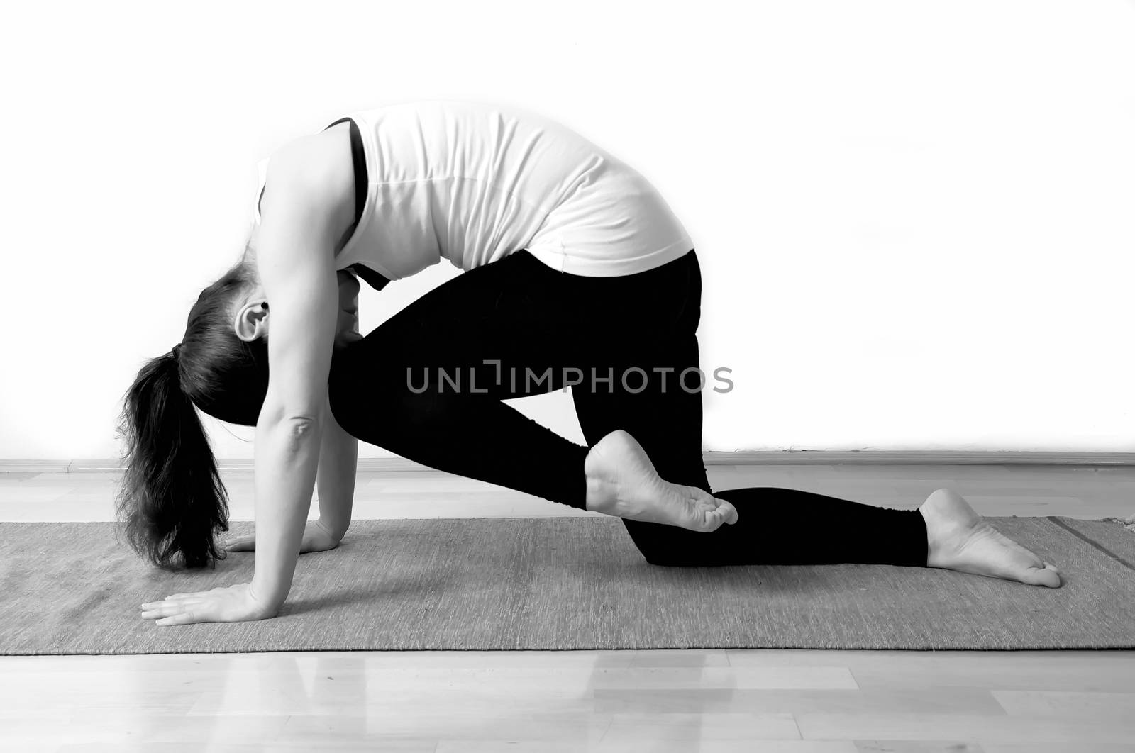Young girl doing yoga pose by anderm