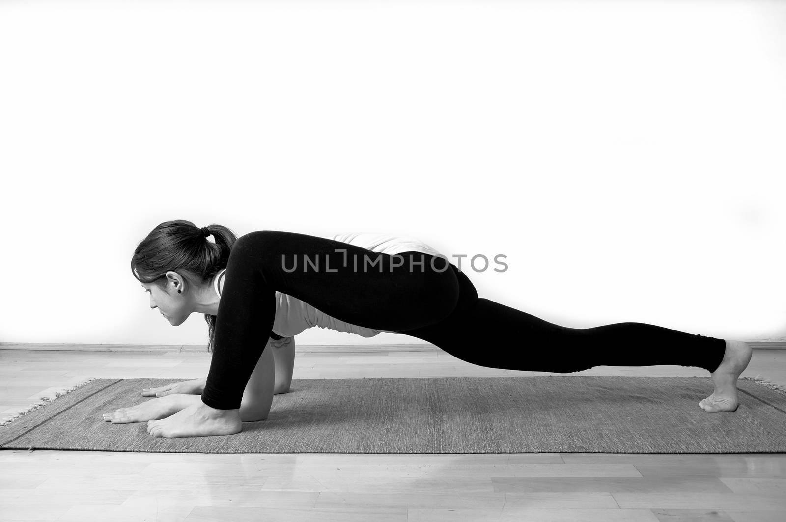 Young girl doing yoga pose by anderm