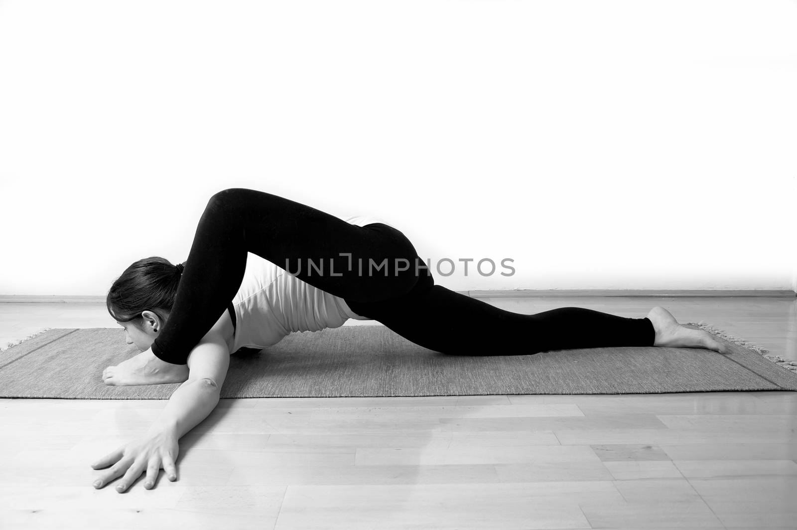 Young girl doing yoga pose by anderm
