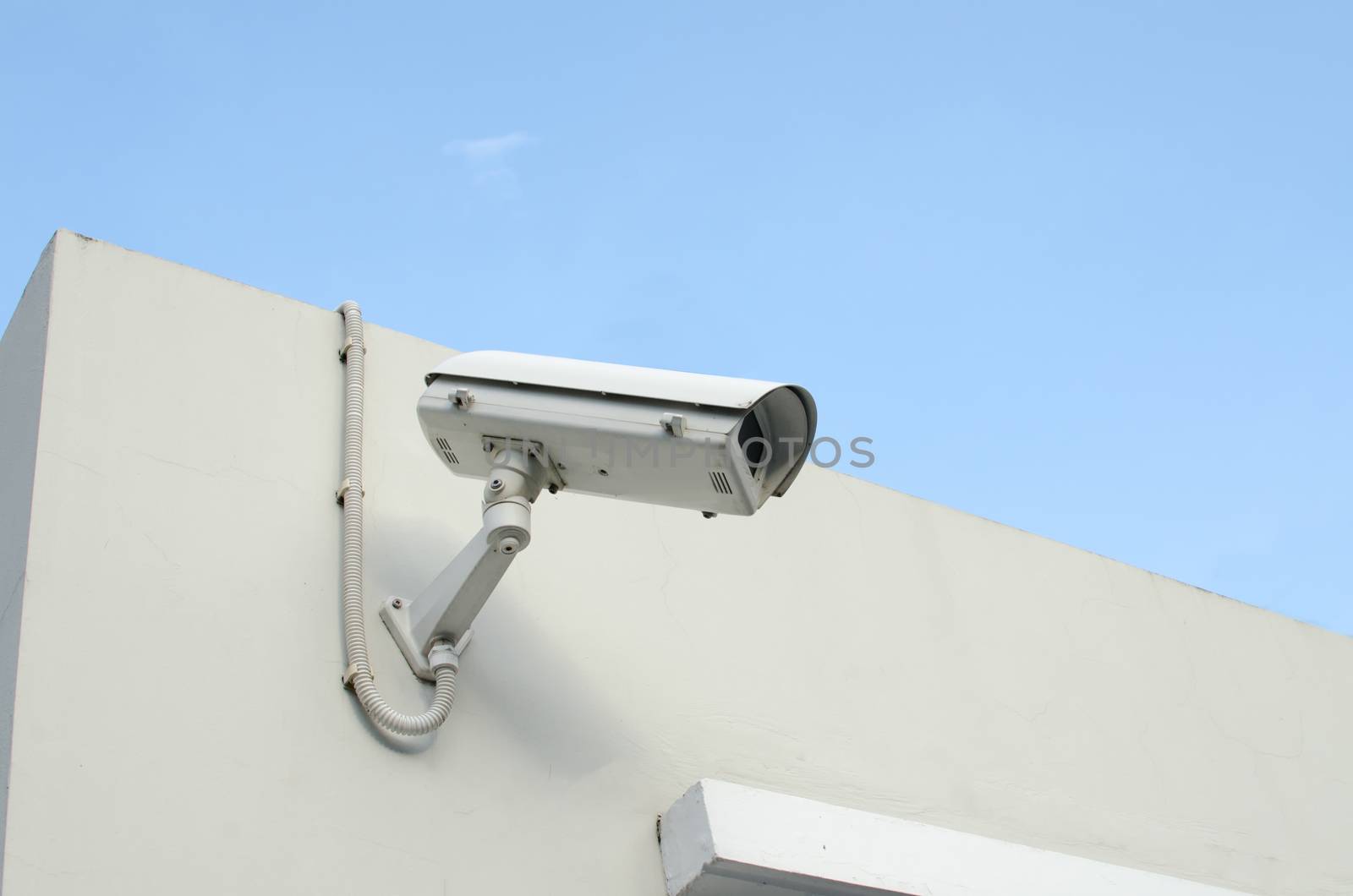 CCTV camera on a wall watch rigth.