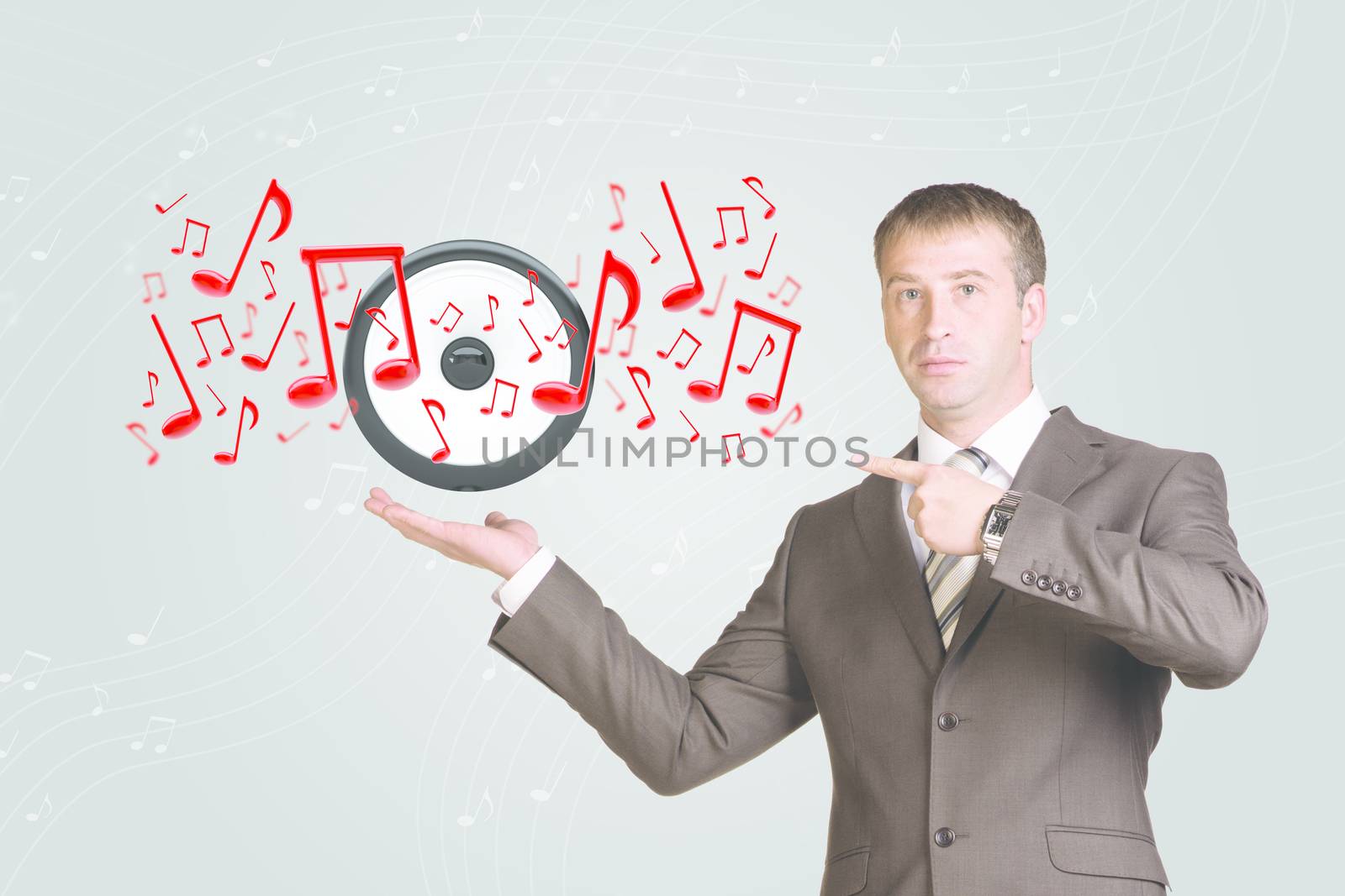 Business man hold audio speaker and music notes in hand. Gray background