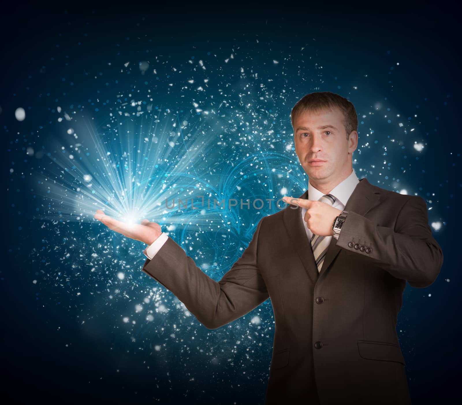 Business man hold magic light in hand. Success concept