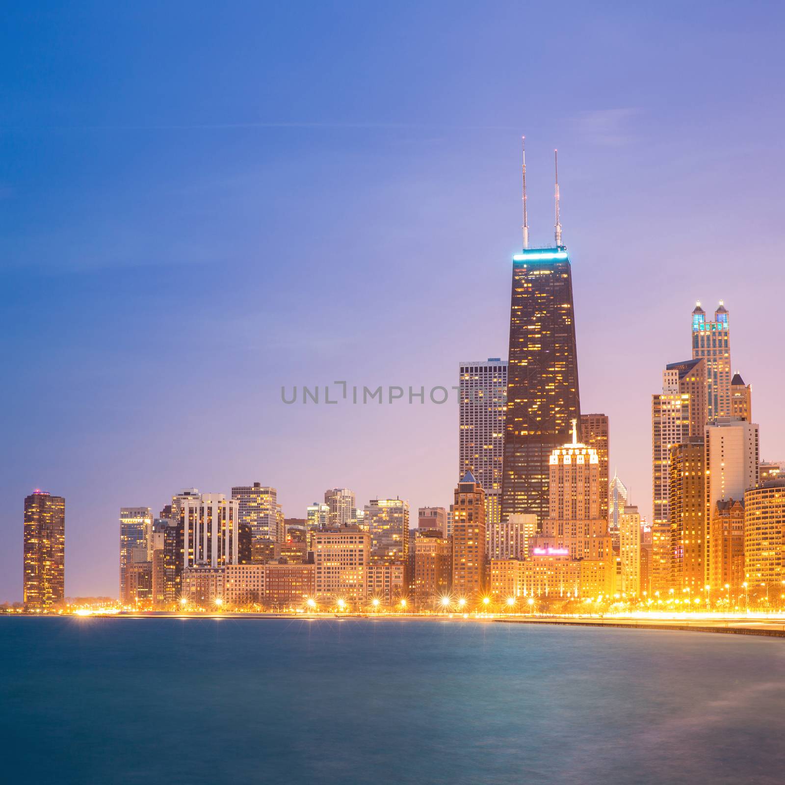 Panorama shot of Chicago downtown and Lake Michigan at dusk.