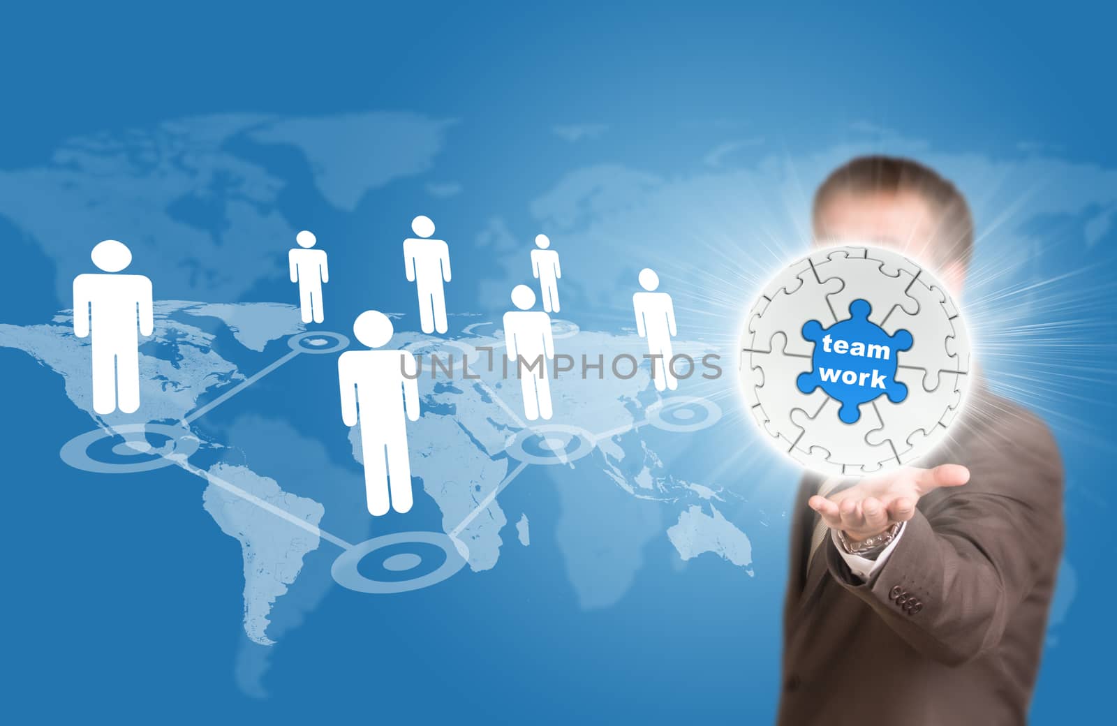 Business man hold puzzle sphere with business label. World map and network as backdrop