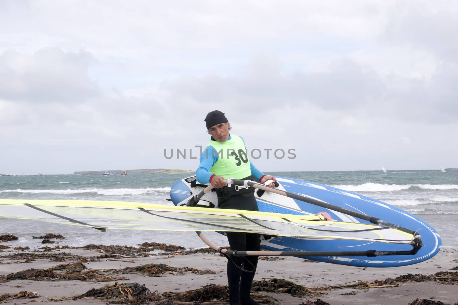 windsurfer getting ready to surf by morrbyte