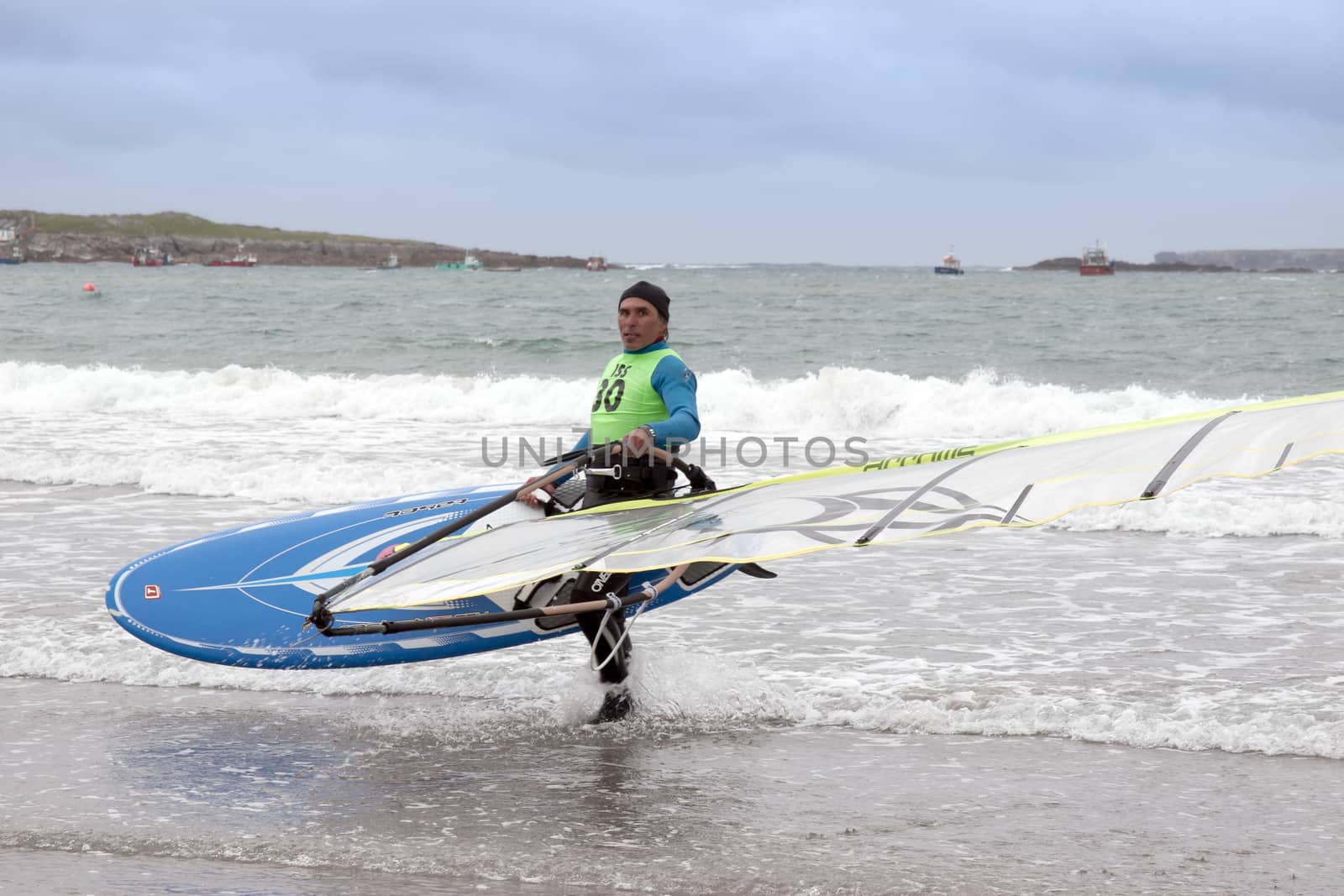 windsurfers getting ready to race and surf on the beach in the maharees county kerry ireland