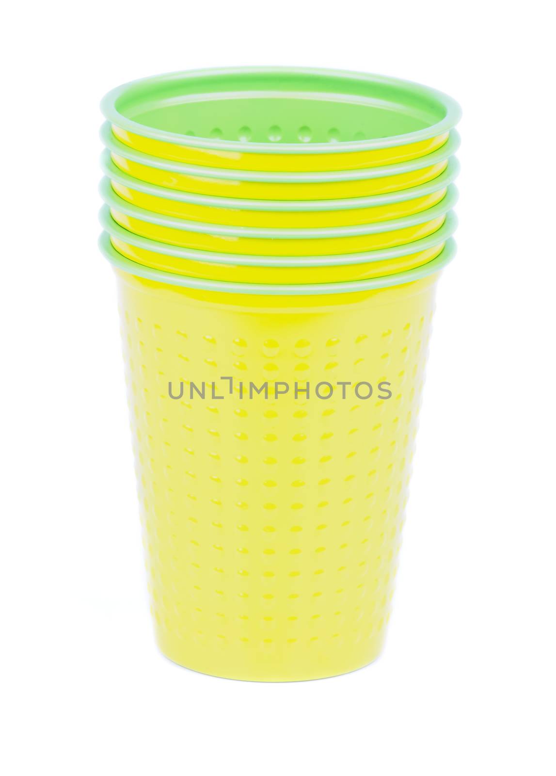 Stack of Yellow and Green Disposable Plastic Cups isolated on white background