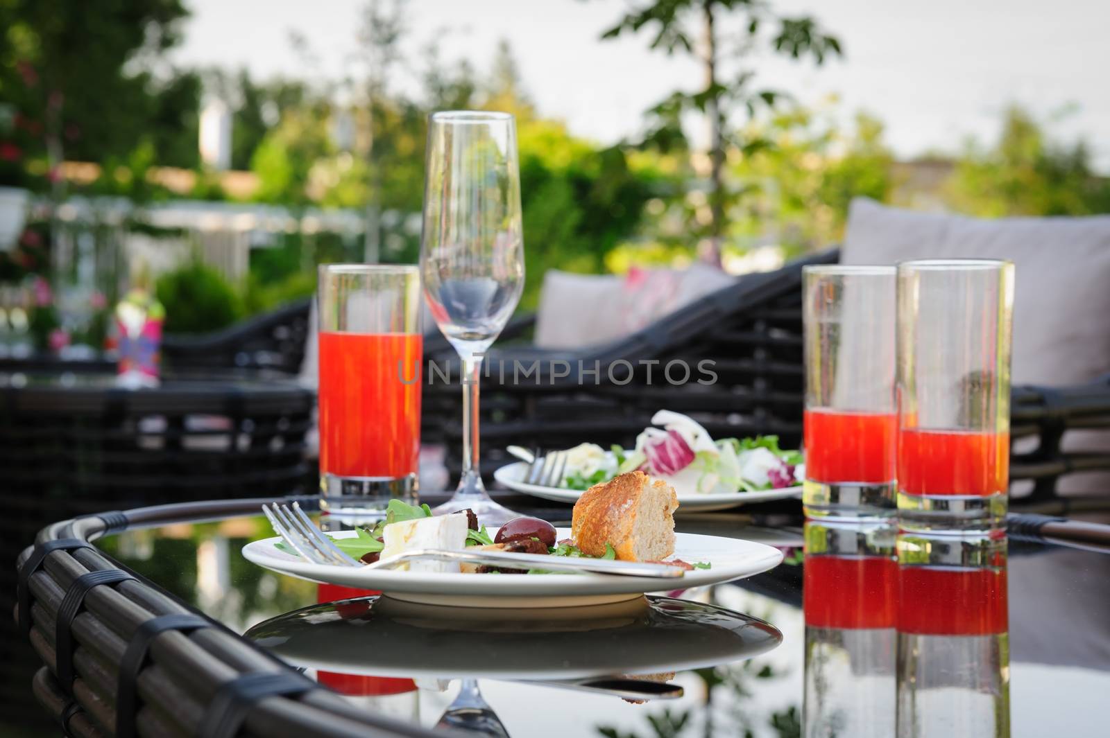 Leftover food an table after outdoor partying