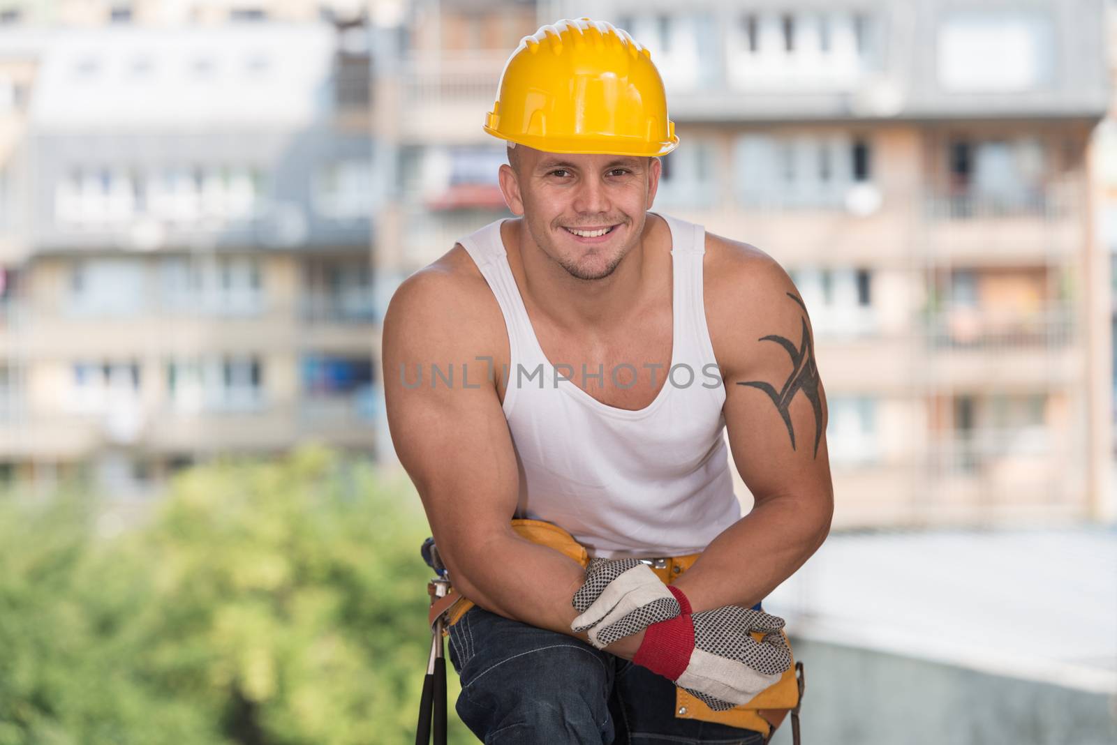 Construction Worker Taking A Break On The Job by JalePhoto