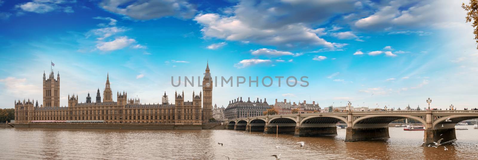 Westminster, London. View of Bridge and Houses of Parliament from across river Thames.
