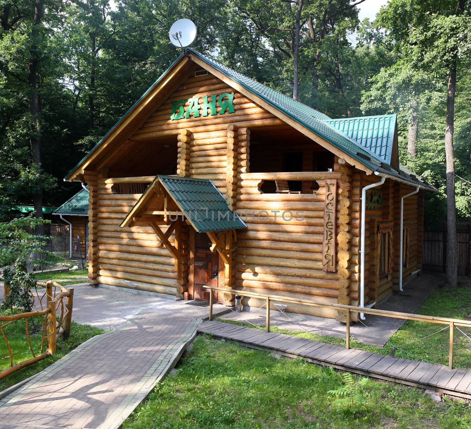 A general view of the log building modern baths in summer