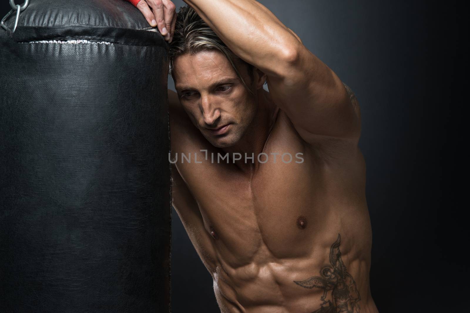 A Man With A Tattoo In Red Boxing Gloves - Boxing On Black Background - The Concept Of A Healthy Lifestyle - The Idea For The Film About Boxing