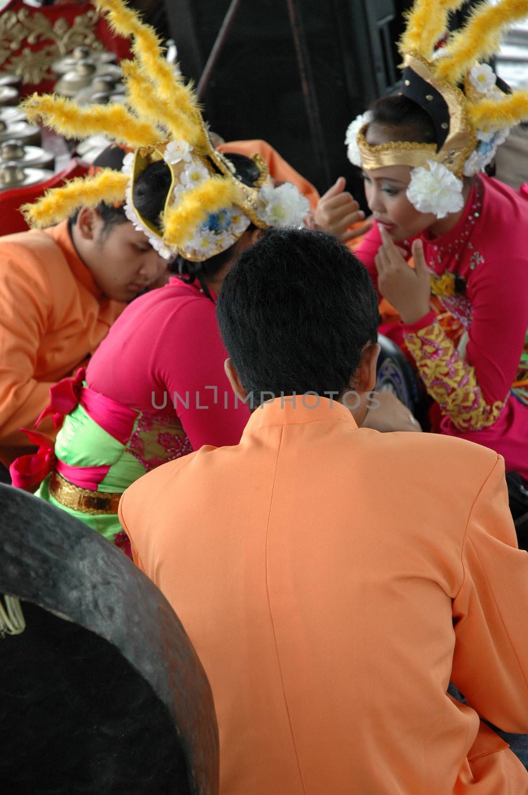 Bandung, Indonesia - March 9, 2008: Dancer member and musical crew gather together and make preparation before get performing on stage at Tegalega Park Bandung, West Java-Indonesia.