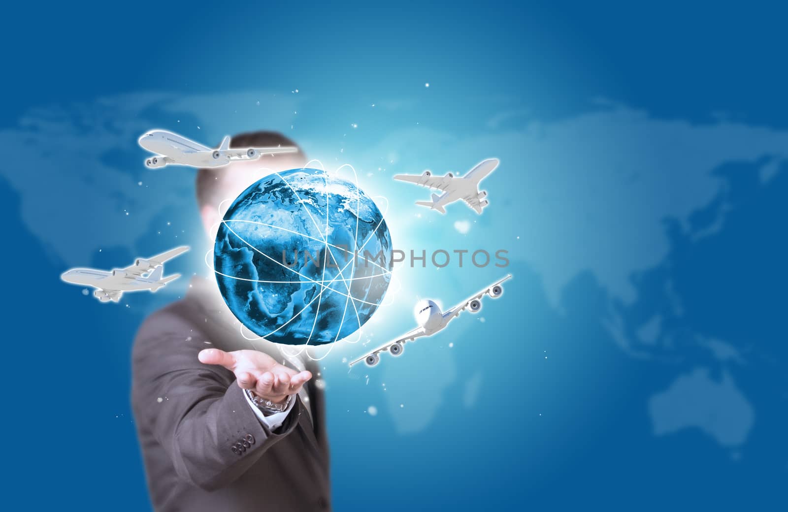 Business man hold Earth with airplanes in hand. World map as backdrop