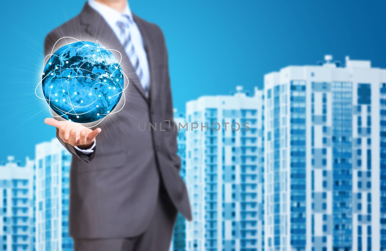 Business man hold Earth in hand. New houses row as backdrop. Elements of this image are furnished by NASA
