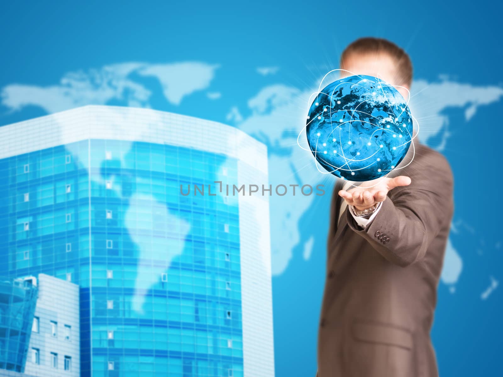 Business man hold Earth in hand. New house and world as backdrop. Elements of this image are furnished by NASA