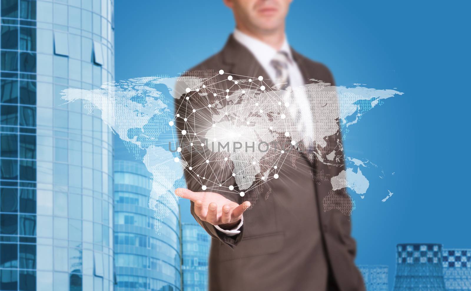 Business man hold world map and wire-frame sphere in hand. Building as backdrop