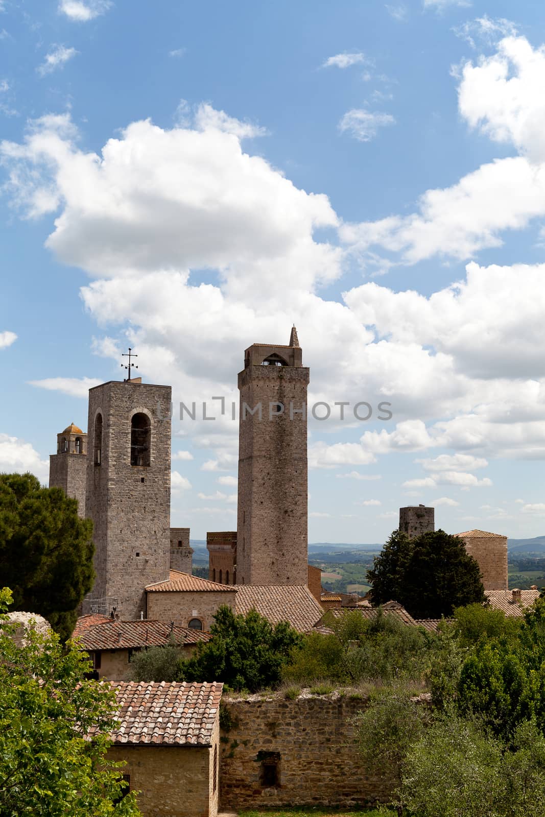 view on some of famous towers in San Gimignano in Toscany in italy on blue sky background