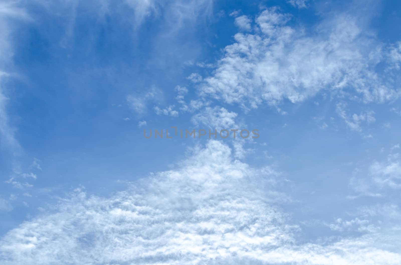 blue sky background with tiny clouds.