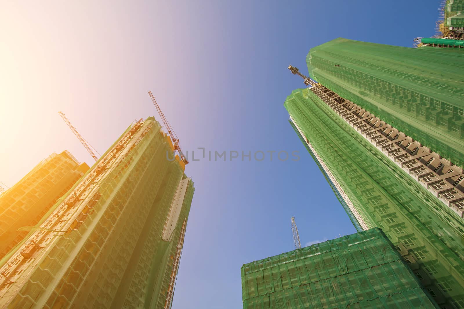Construction site in Hong Kong with sunshine by kawing921
