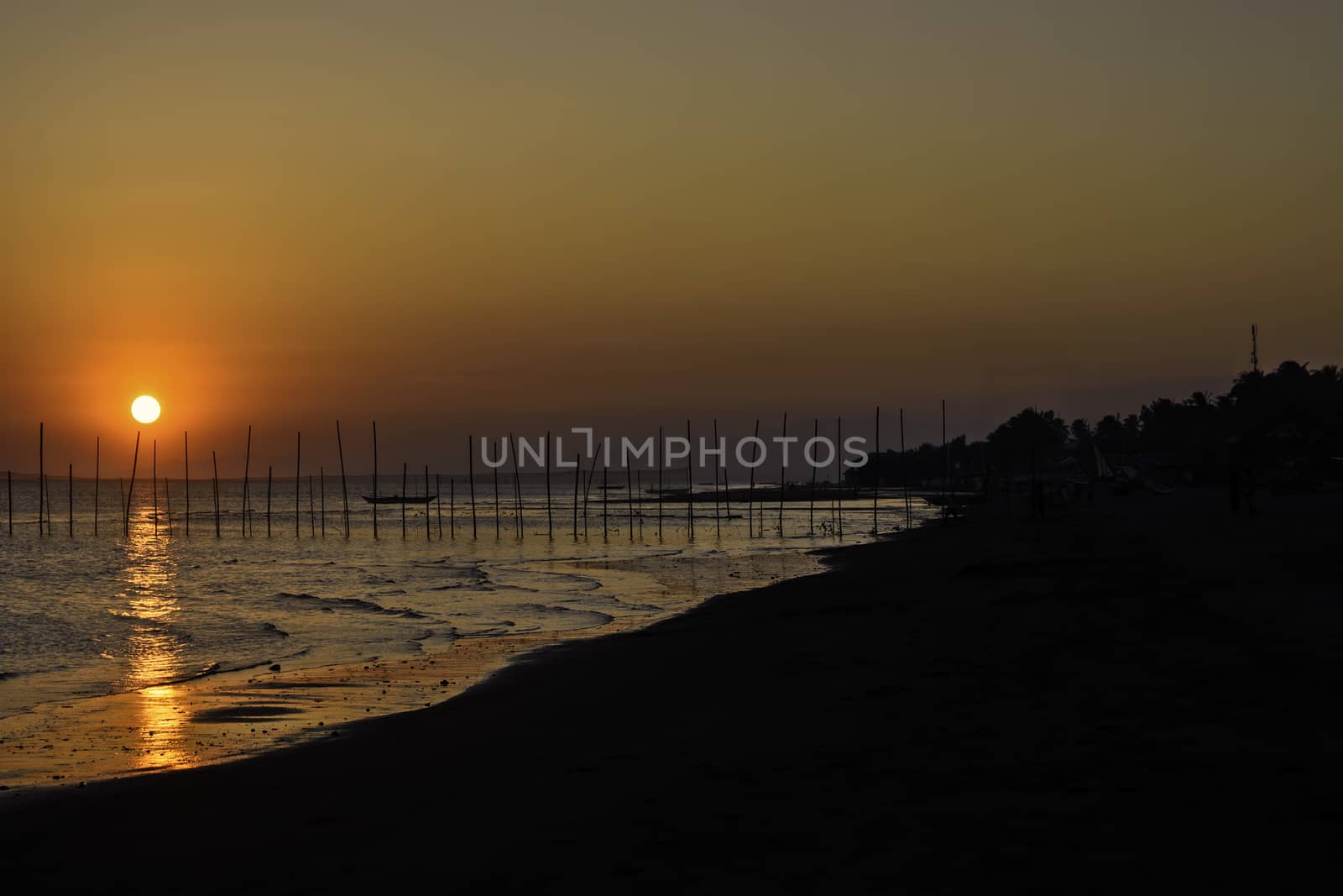 Sunset over a fishing village in the Philippines.