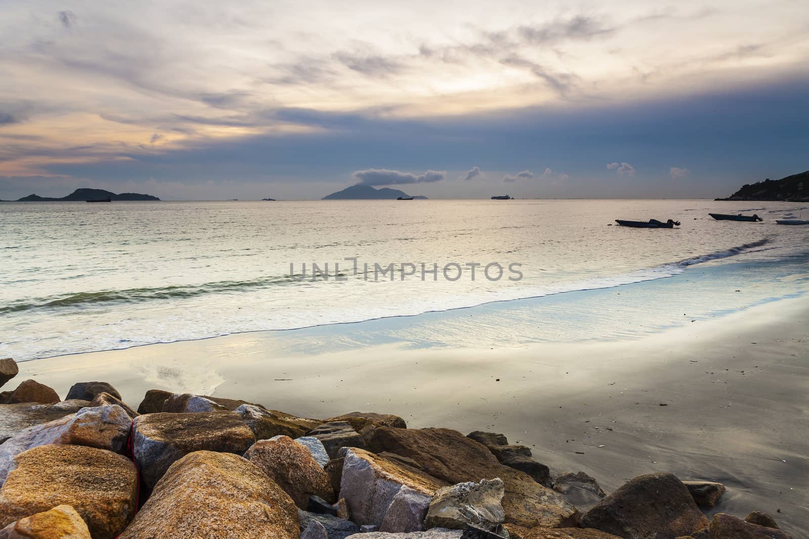 Sunset over the ocean in Hong Kong coast by kawing921