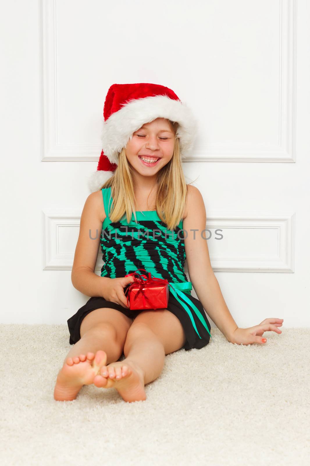 Cute little girl in the santa claus hat