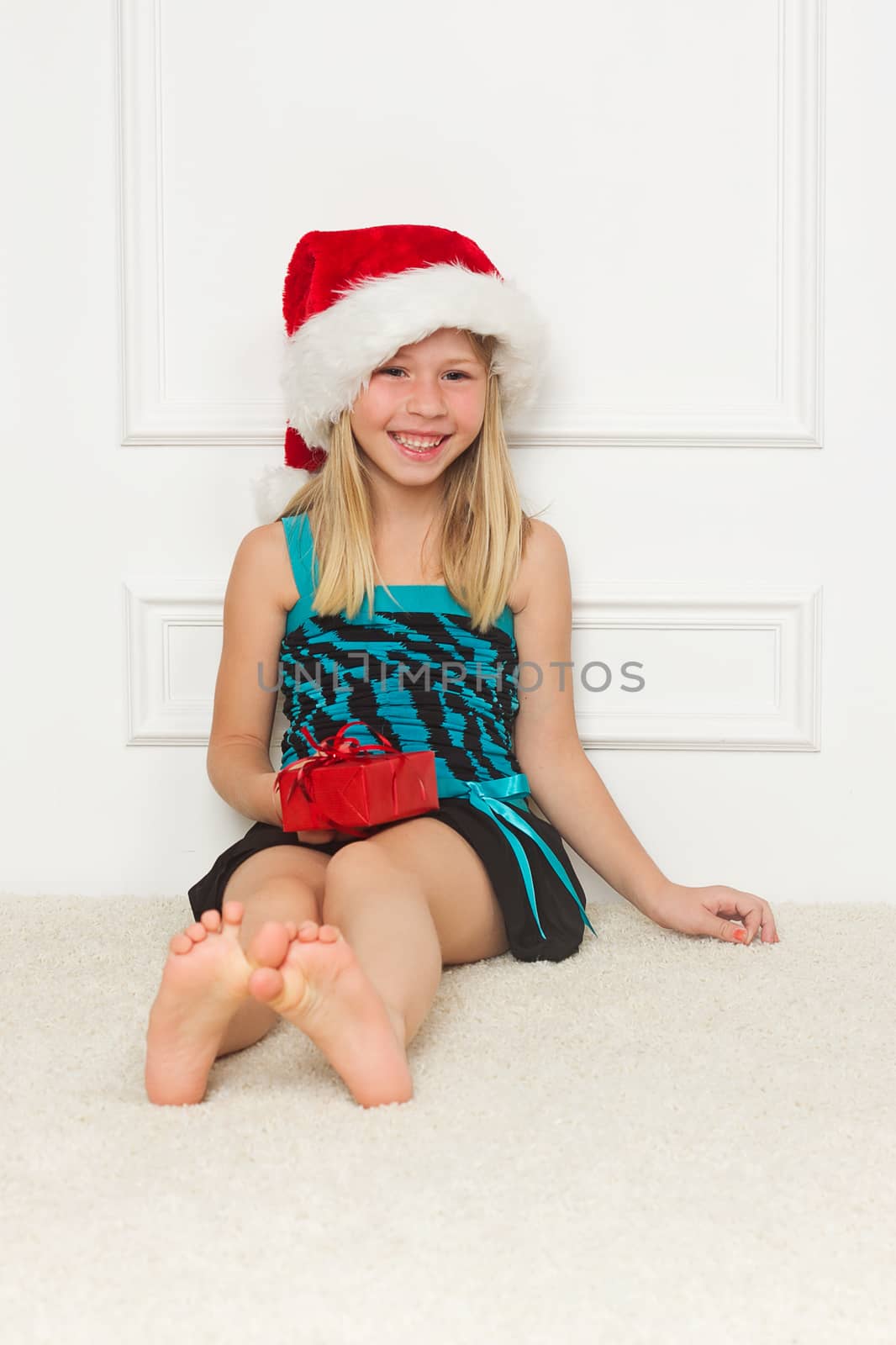 Cute little girl in the santa claus hat
