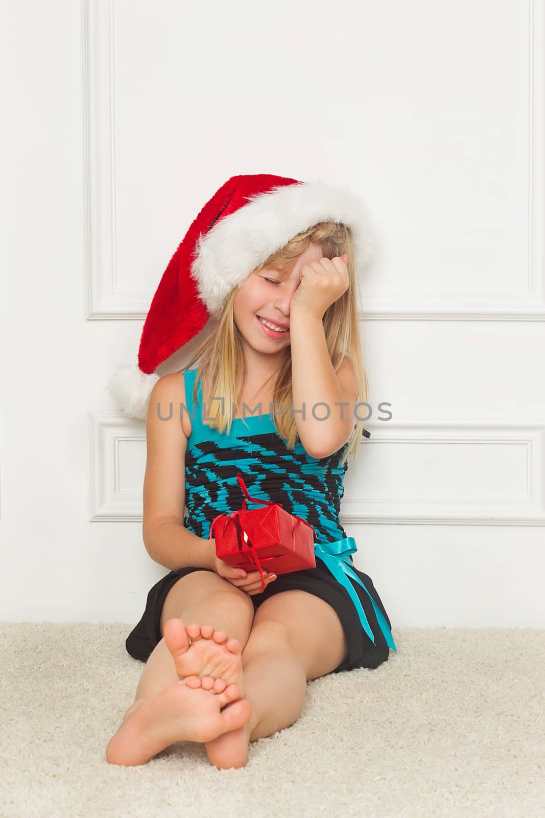 Cute little girl in the santa claus hat