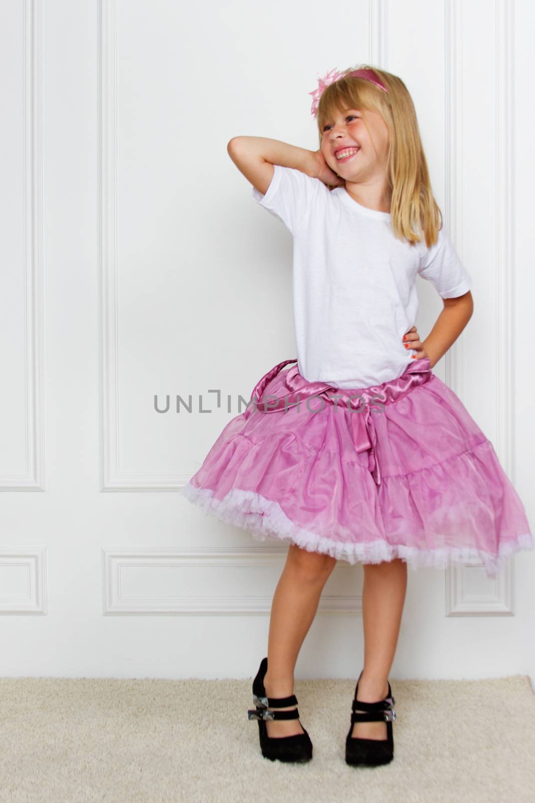 girl in a pink dress. studio shot