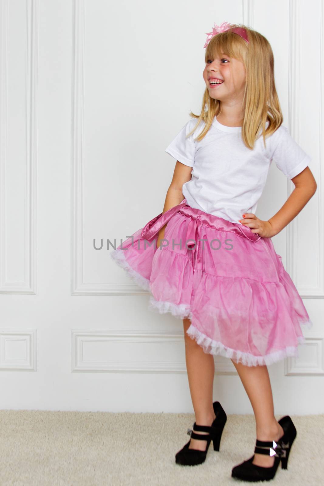 girl in a pink dress. studio shot