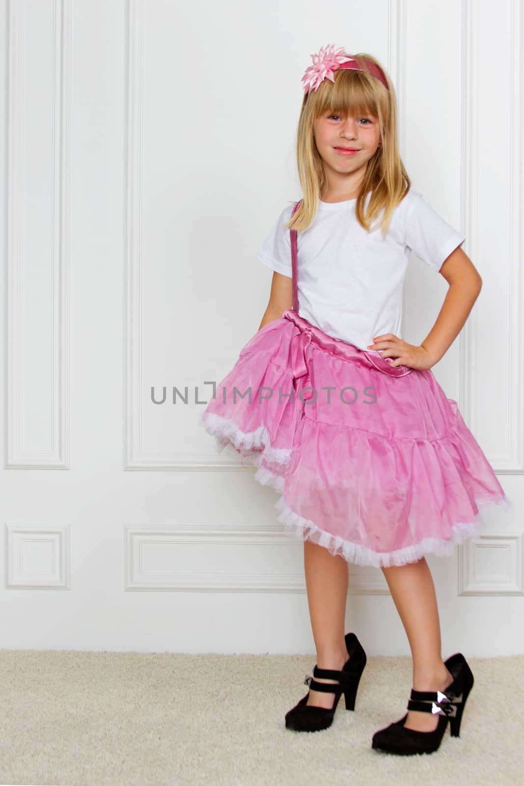 girl in a pink dress. studio shot