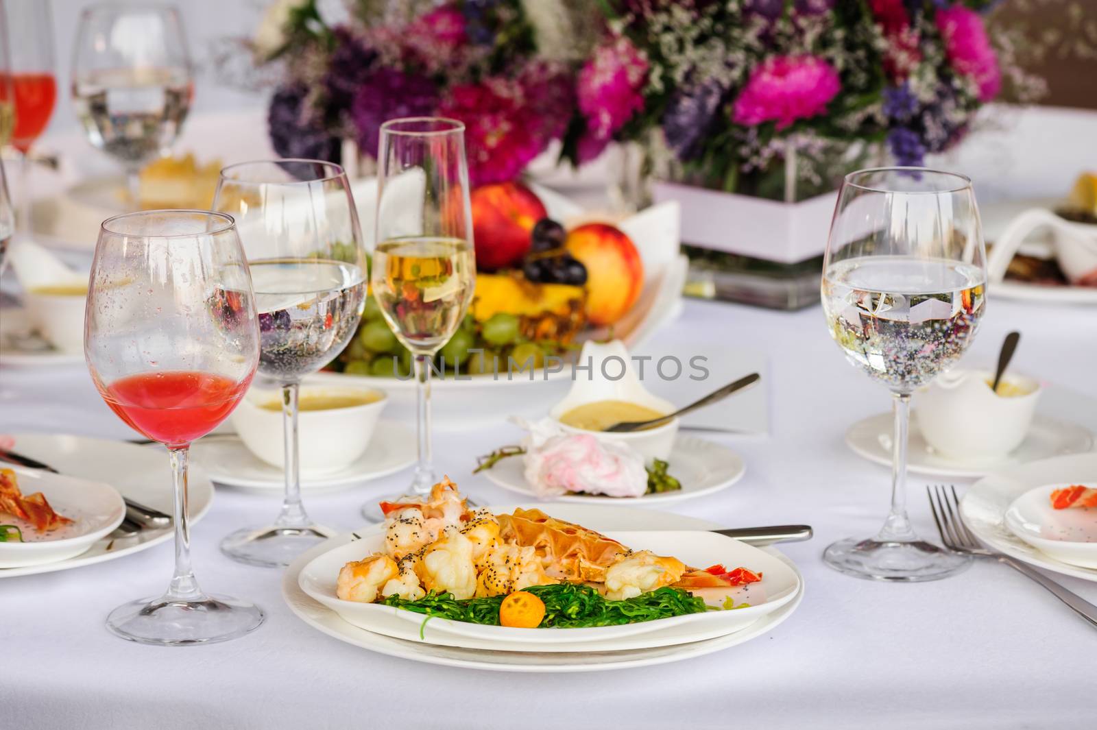 Prepared lobster and sea weed served on plates