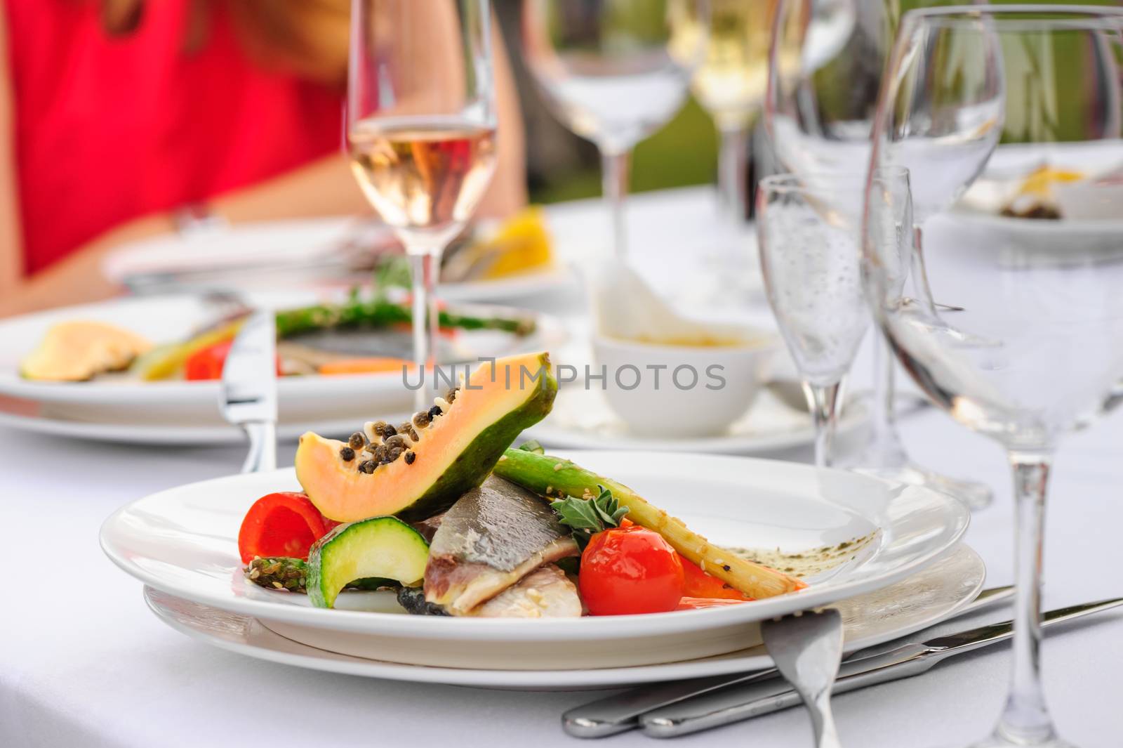Prepared fish filletwith papaya, asparagus and tomato