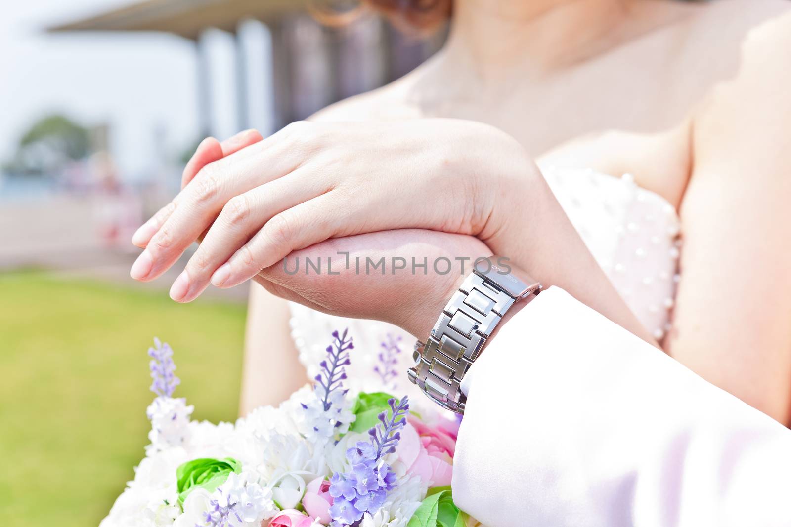 Couple hands closed together outdoors