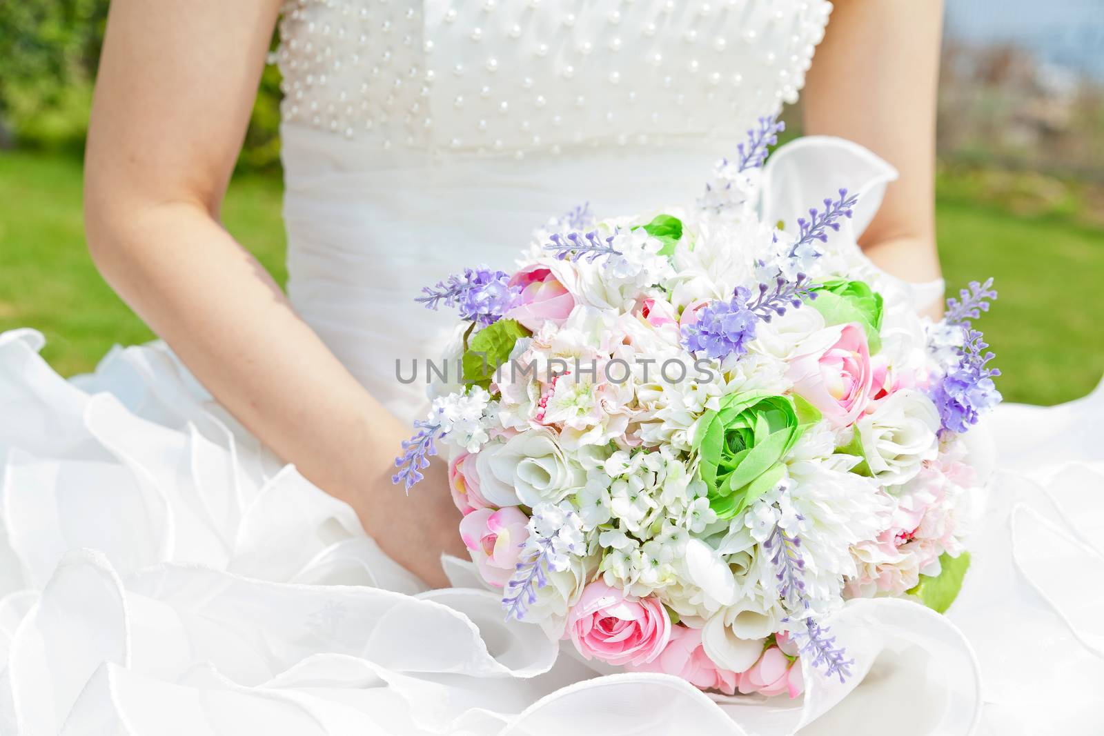 Bouquet in the hands of the bride