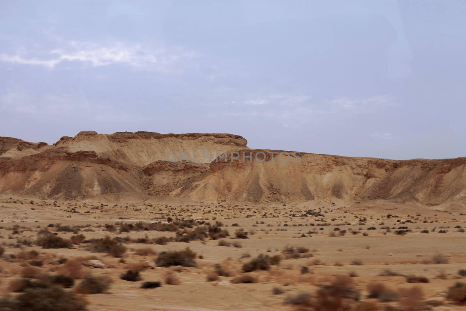 An Egyptian Desert And Mysty Sky in the daylight