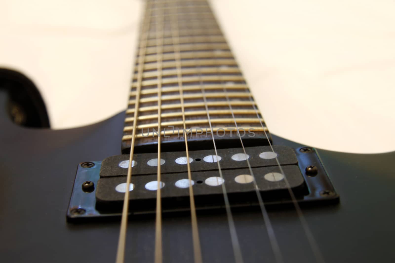 Black electric guitar isolated on the white backgriund